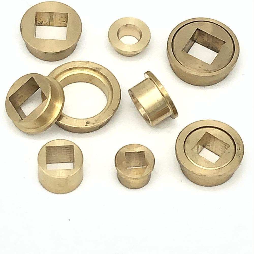 Assorted flanged and square-bore metal bushes