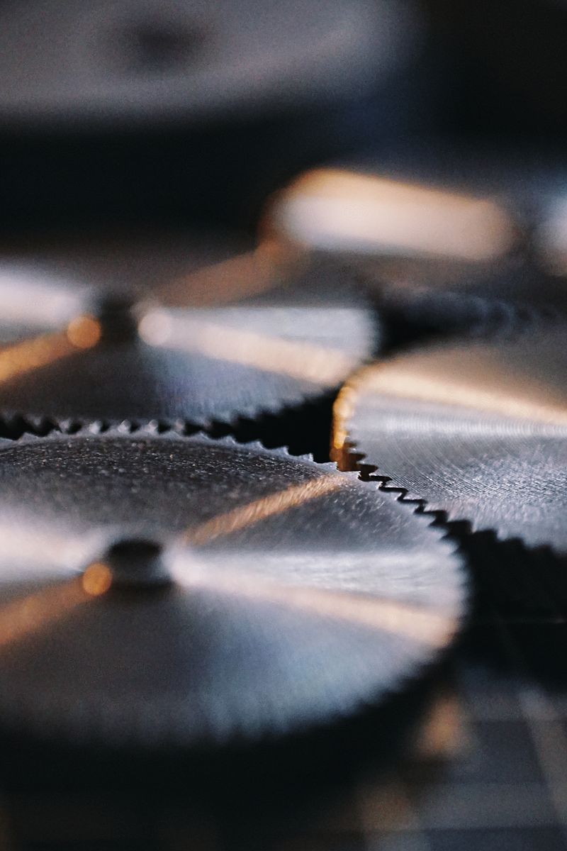 Interlocking machinery gears — illustrative stock photo